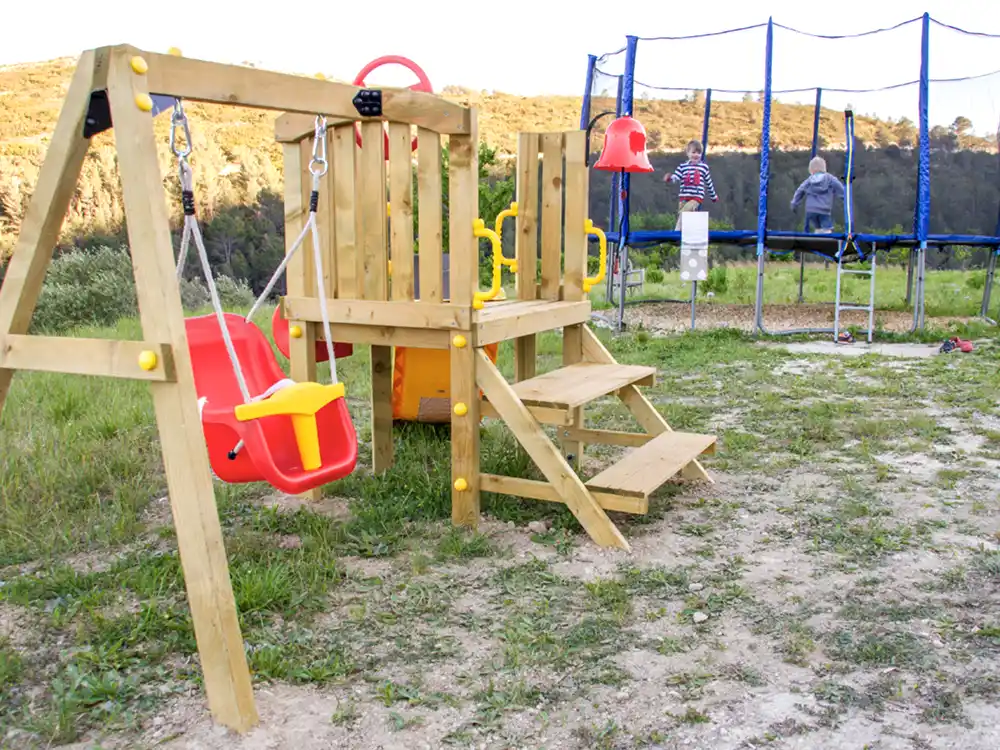 Another reason we think we're the most baby-friendly hotel in Spain: We have a swings and a slide especially for babies and toddlers and a separate outdoor play area for older children. The trampoline is popular with everyone! babies, children and adults alike!