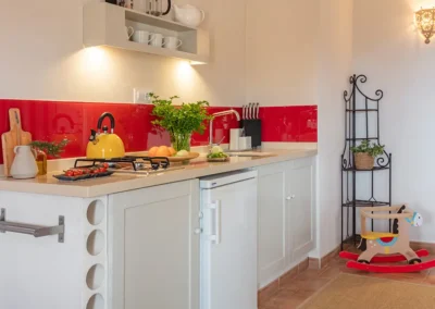 Taronger family suite has a well equiped kitchenette and toys for children