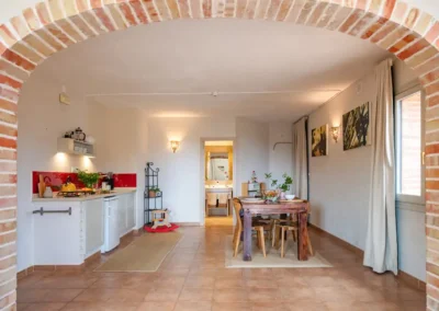 View from the lounge of Taronger toddler friendly suite, with a kithenette, big dining area and even a toy kitchen for the children. The bathroom is at the end