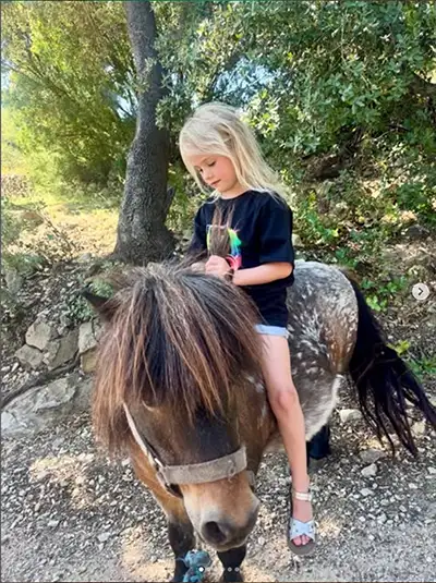 boutique-farm-stay-children toddlers collect fresh eggs at Caserio del Mirador toddler friendly hotel in Spain
