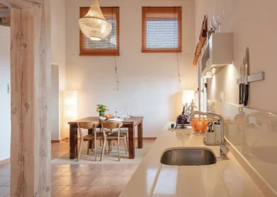 Olivera baby friendly apartment has a mezzanine bedroom opening onto a spacious open plan lounge, kithcen and dining area