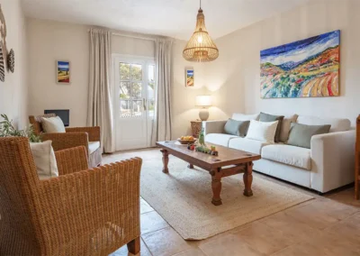 Vinya baby friendly apartment has a spacious lounge leading onto a terrace overlooking the pool