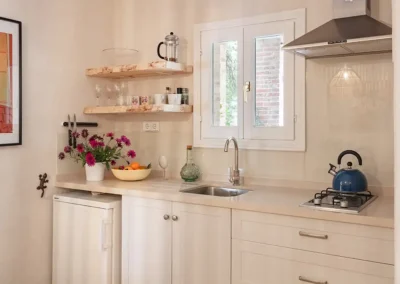 Vinya baby-friendly apartment has an open plan kitchen dining area with a well equipped kitchenette