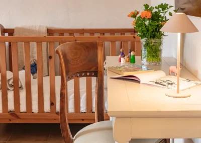 Vinya baby-friendly suite has a spacious lounge with a big cot and work space